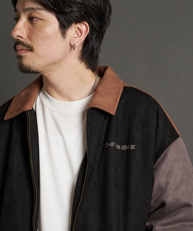 Sand-colored leather jacket with patches and zip fastening