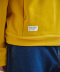 go slow caravan(ゴースローキャラバン) |DUCKSTER/ダックスター ペンキ飛ばし刺繍 カレッジロゴフーディ (MENS)